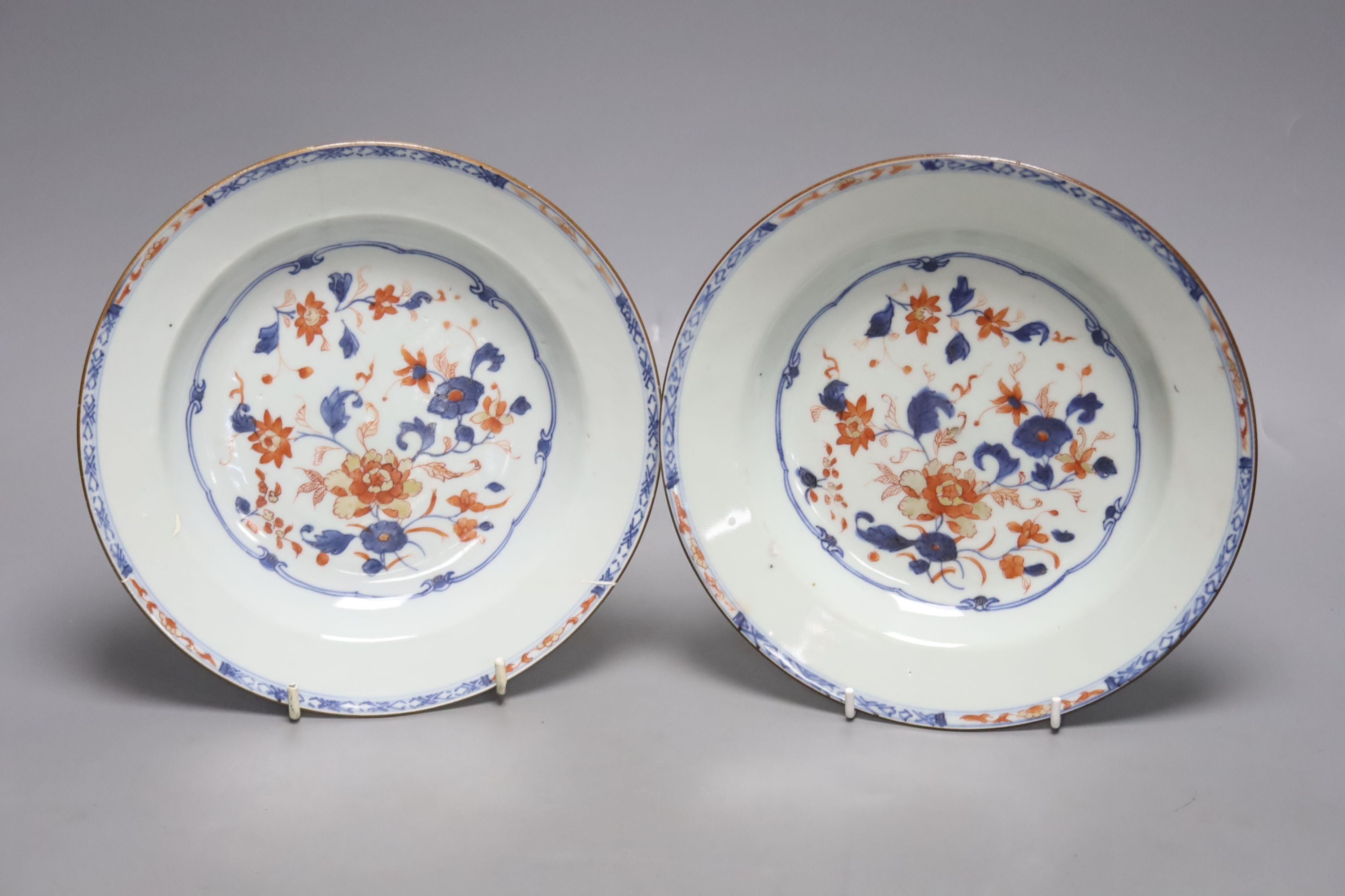 A pair of 18th century Chinese Imari style dishes, diameter 22.5cm, together with a similar chocolate pot and an 18th century Japanese Arita teapot, associated cover